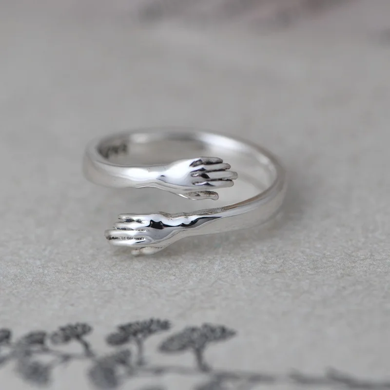 

Glossy 925 Silver Unusual Creative Hug Rings for Women Shining Mirror Silver Novelty Gifts Trendy Jewelry Opening Hands Ring