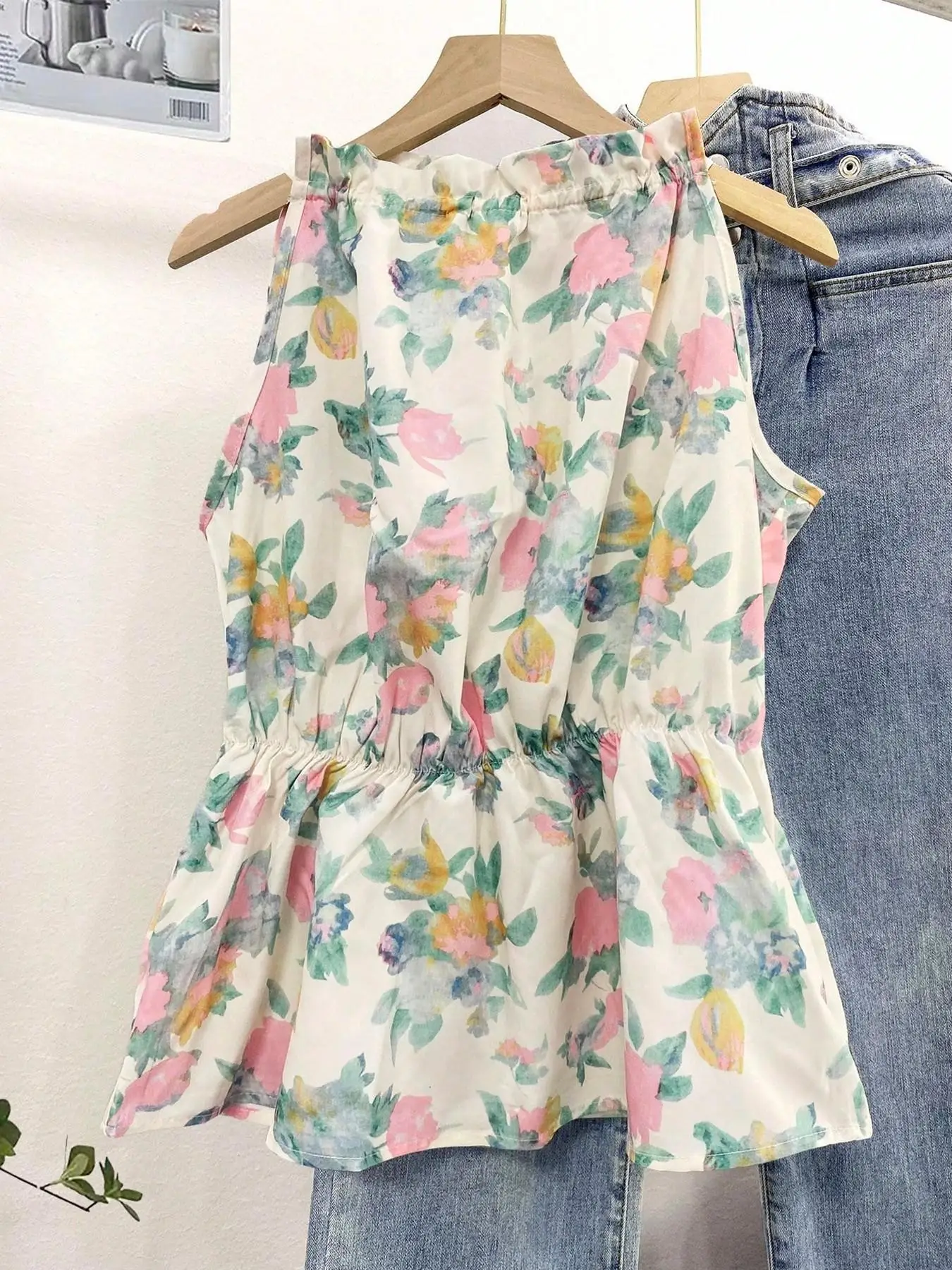 Ladies Woven Floral Print Sleeveless Top with Ruffle Collar Back Tie Waist And Flared Hemline Single Piece