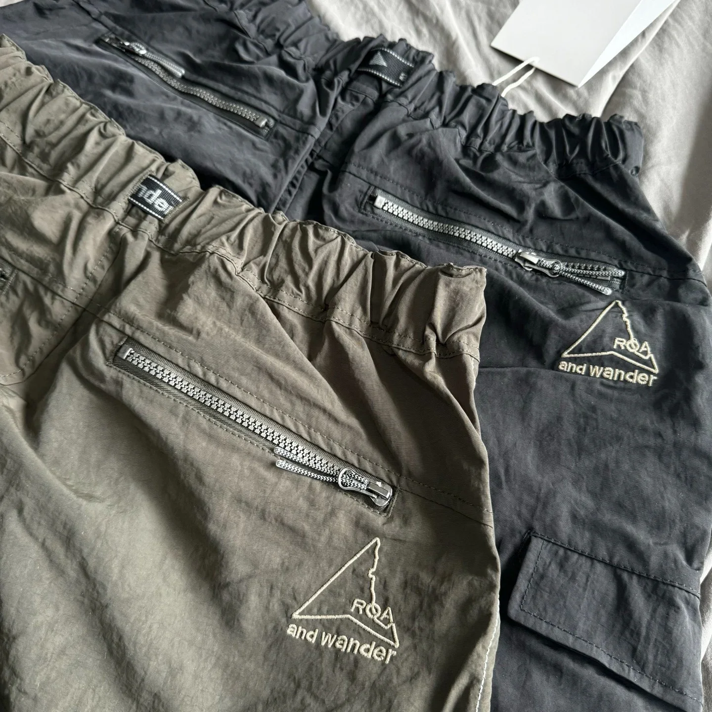 ROA x and wander Nylon Cargo Pants 3M Reflective Strip Zipper Cuff Buckle Adjust Multi Pocket Loose Outdoor Hiking Trousers