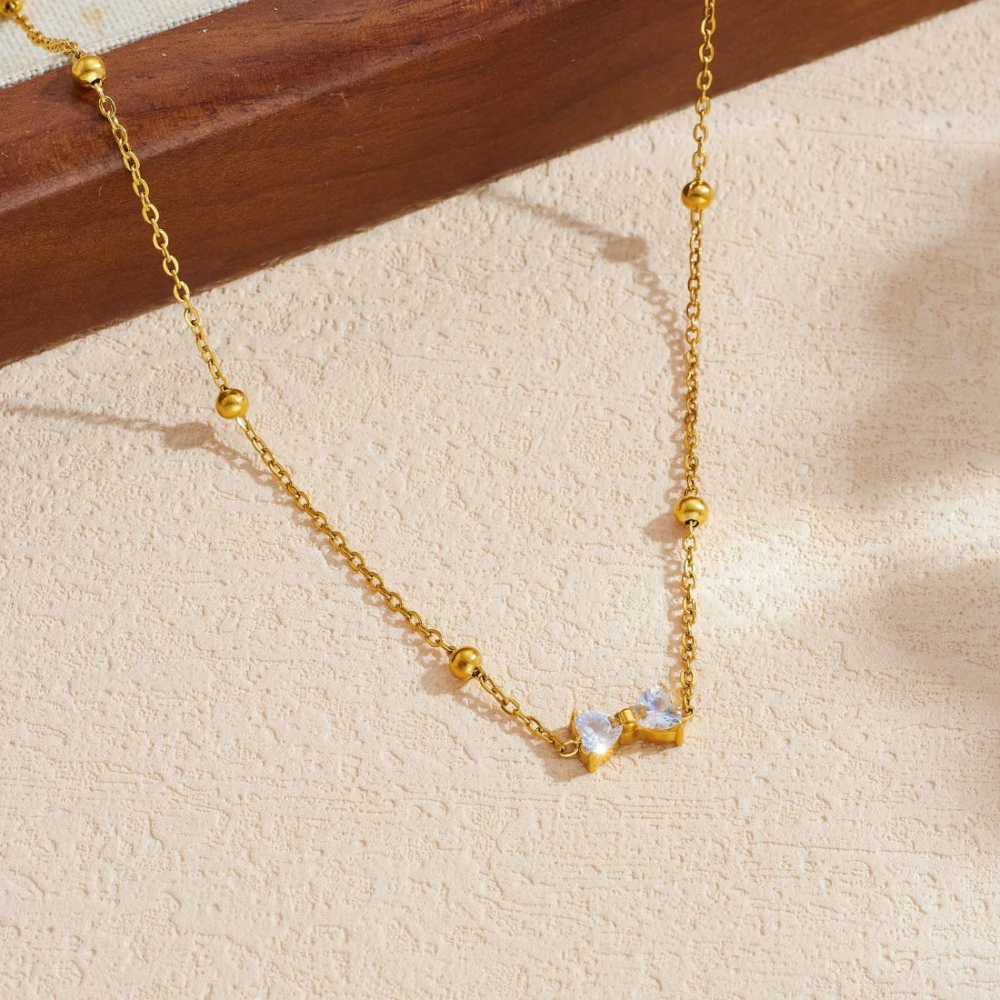 DIEYURO 316L Stainless Steel Simple Bowknot Inlay Zircon Golden Ball Necklace For Women Fashion Waterproof Neck Chain Jewelry view 4