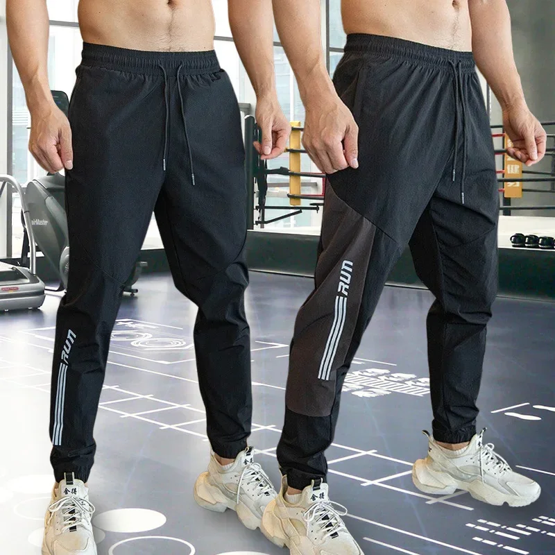 

Mens Gym Fitness Running Sweatpants Workout Athletic Long Pants Outdoor Training Sports Trousers Elastic Waist Zipper Pockets