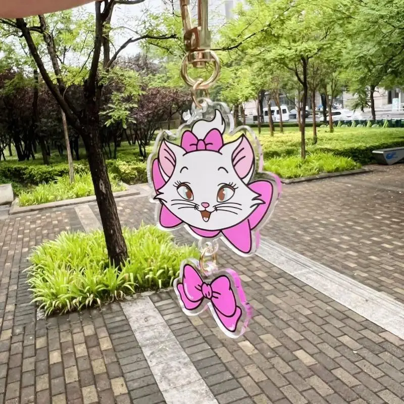 Disney Marie Cat portachiavi acrilico Kawaii Anime Cartoon Design creativo arco in Pvc portachiavi ciondolo zaino decorazione ragazza regali