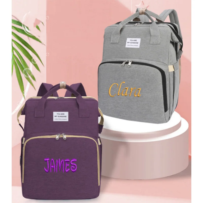 Bolsa de mamá de cama plegable portátil personalizada para salir, bolsa ligera y de gran capacidad para madre y bebé, mochila