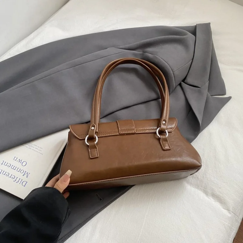 

Classic Parisian Style Women Handbag With Top Handle And Detachable Strap For Versatile Elegant Evening Wear