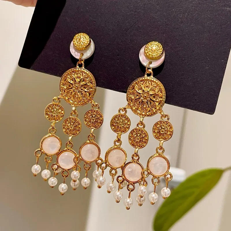 

Metal disc earrings pearl tassel earrings