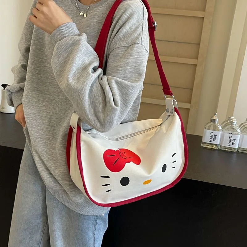 2024 New Sanrio Hello Kittys borsa di tela simpatico cartone animato stampa a schermo intero ragazza cuore Casual Versatile borsa a tracolla giocattoli regali per ragazza