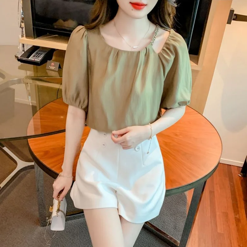 2024 New Summer Elegant French High-end Fashion Round Neck Hollowed Out Loose and Simple Casual Versatile Bubble Sleeve Shirt