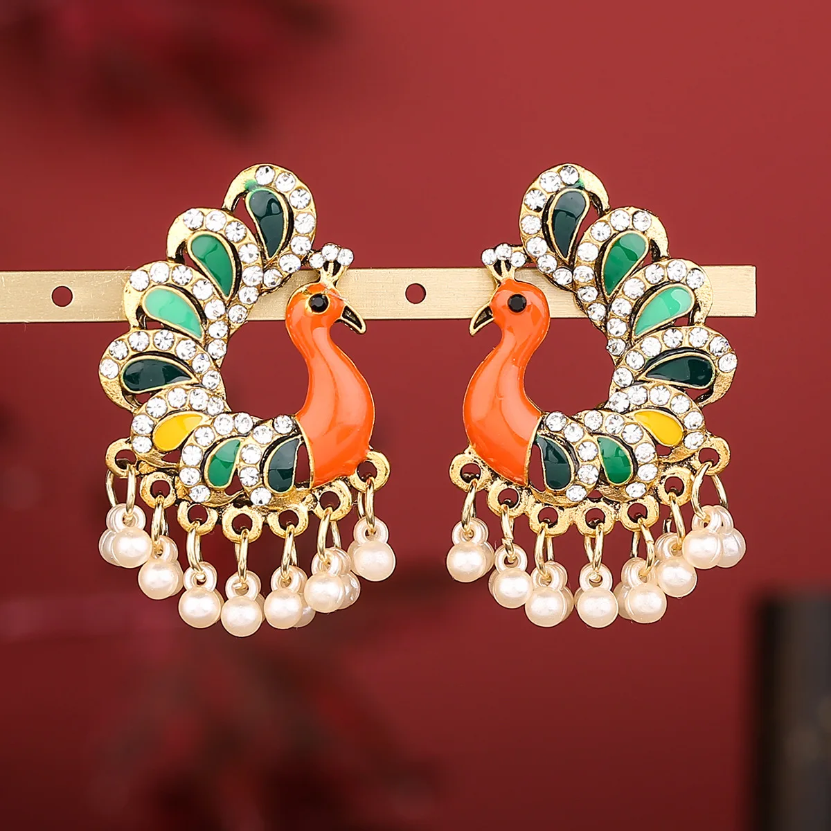 Cross-border earrings, peacock dripping oil, retro style, Indian bell alloy rice bead earrings, jewelry factory direct sales