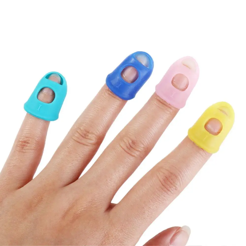 4 ชิ้น/เซ็ตลื่นกีตาร์ปลายนิ้วป้องกันยางสีทึบ Thimble ซิลิโคน Finger Guards DIY Craft ถุงมือ