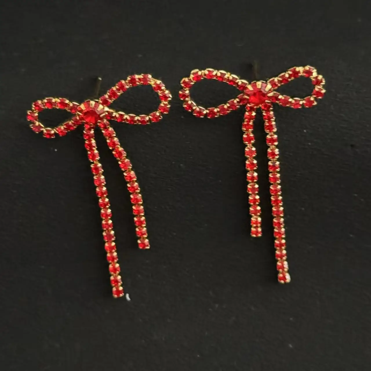Hot selling new item, niche super sparkling diamond studded bow earrings, female sweet tassel hollow out simple earrings and ear