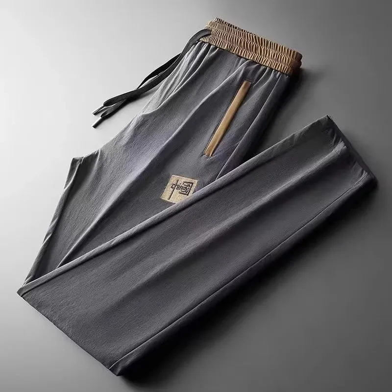 

Men's Casual Ice Silk Sports Pants Summer Thin Loose Straight Leg Elastic ket Zipper Long Trousers for Working And Leisure