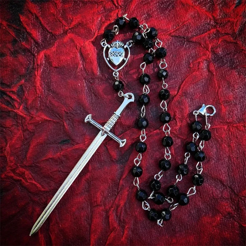 Black glass bead rosary style necklace with large sword pendant and Sacred Heart centerpiece