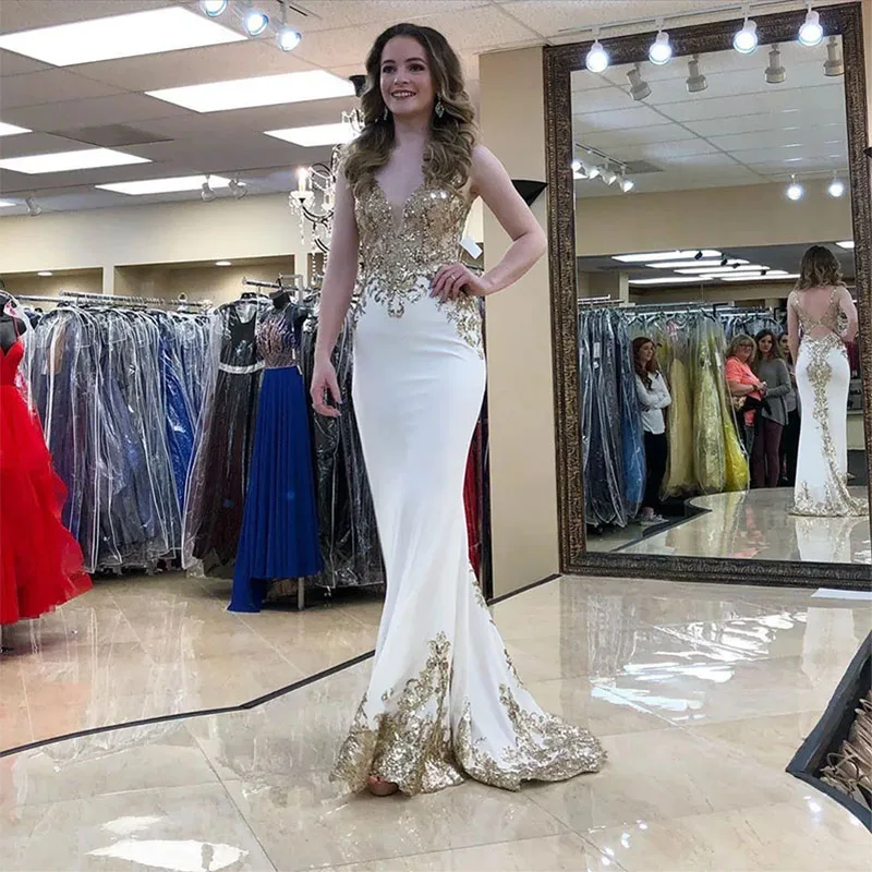 

Stunning Gold Appliqued Backless Prom Dresses Sheer Deep V Neck Sleeveless Sequined Evening Gowns Floor Length Formal Dress