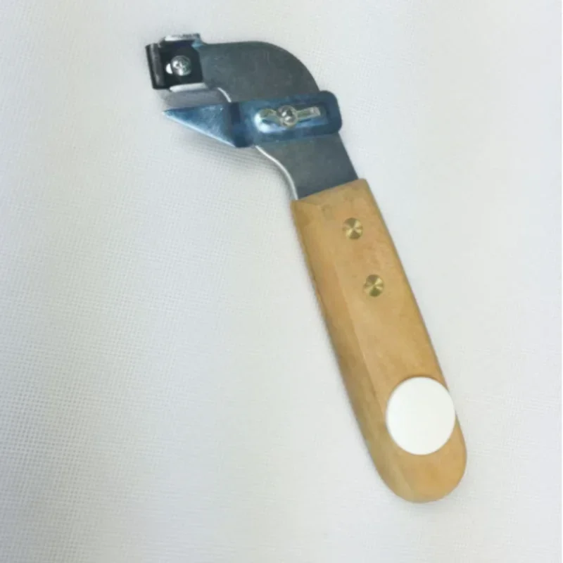 

A slotting knife with a guide hook for irregular curves of PVC plastic flooring