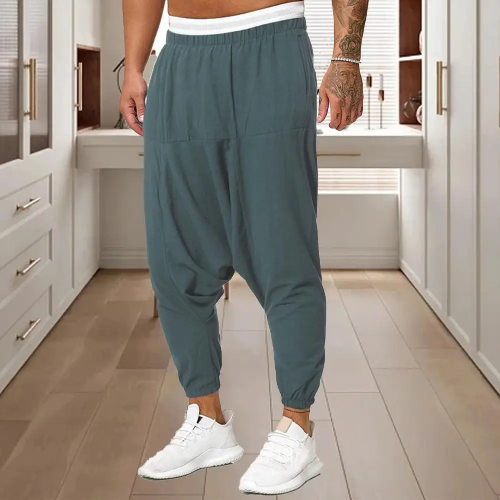 

Men Pants Solid Color Ankle-banded Baggy Loose Elastic Waist Daily Pleated Deep Crotch Sweatpants Autumn Winter Male Clothes