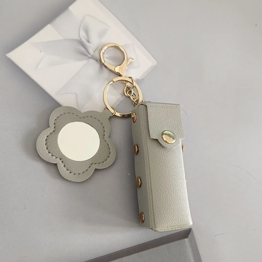 Przenośna kosmetyczka na szminki, mini lusterko w kształcie kwiatka z PU skóry, breloczek do kluczy z lusterkiem do makijażu, zawieszka do plecaka, brelok do kluczy, prezent.