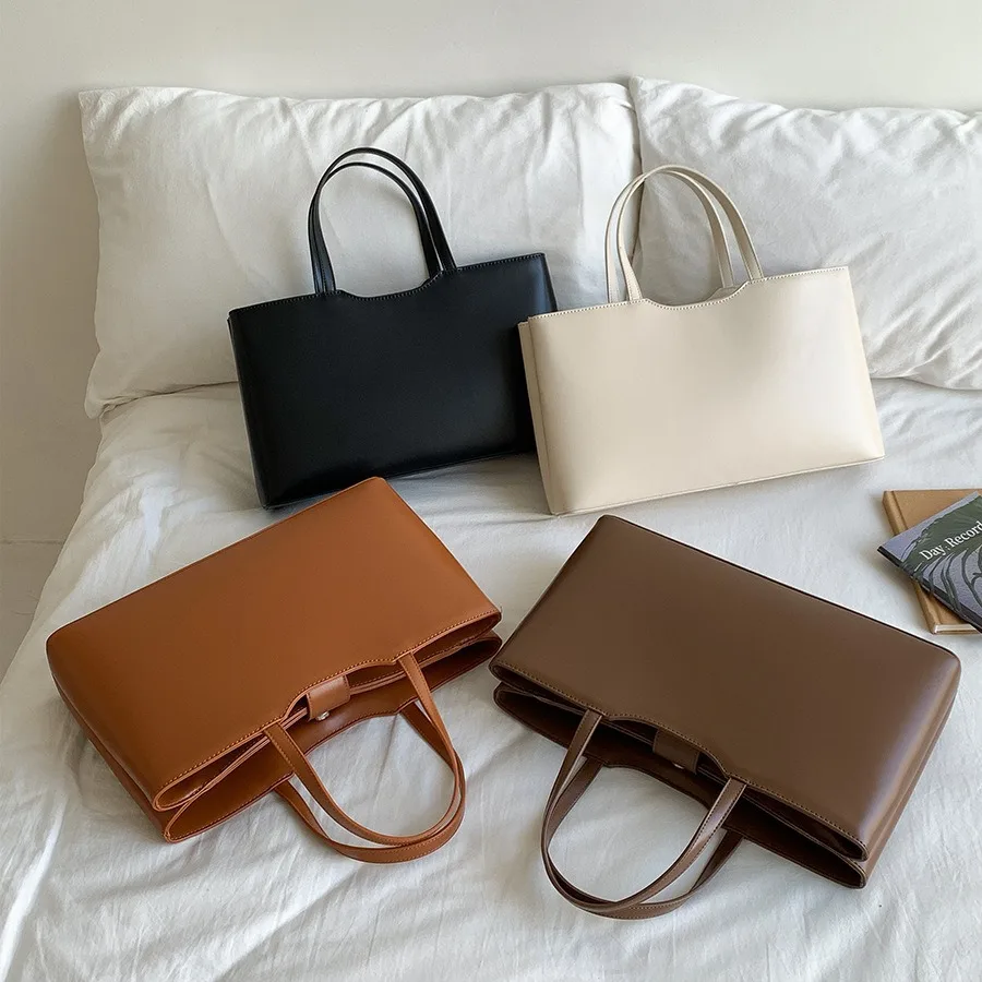 

Simple solid color large capacity hand-held tote bag with a high-end feel for women's daily elegant commuting PU leather handbag