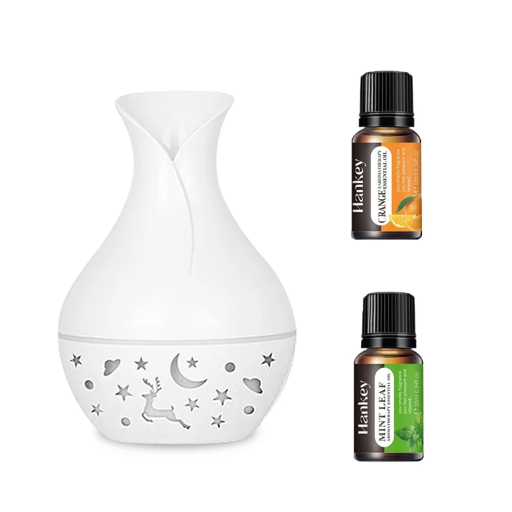 

USB Desktop Air Humidifier Ultrasonic 200ML Essential oil diffuser Cold mist Air moisturizer and two bottles of essential oil.
