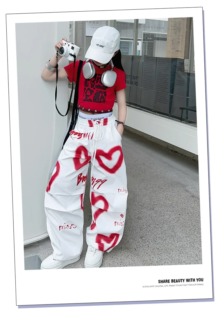 Kinder Hip-Hop Modehose mit Kordelzug und Zeichnungen für Teenager-Mädchen Coole Y2K Streetwear-Hose mit Herz-Graffiti 5-14 Jahre – Detail 6