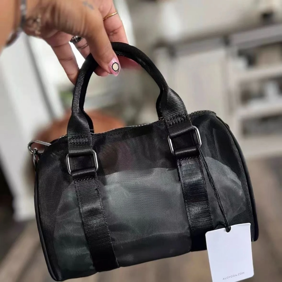 

@LO Mini hollow handbag advanced design sense dual purpose mesh surface wear-resistant single shoulder oblique span bag