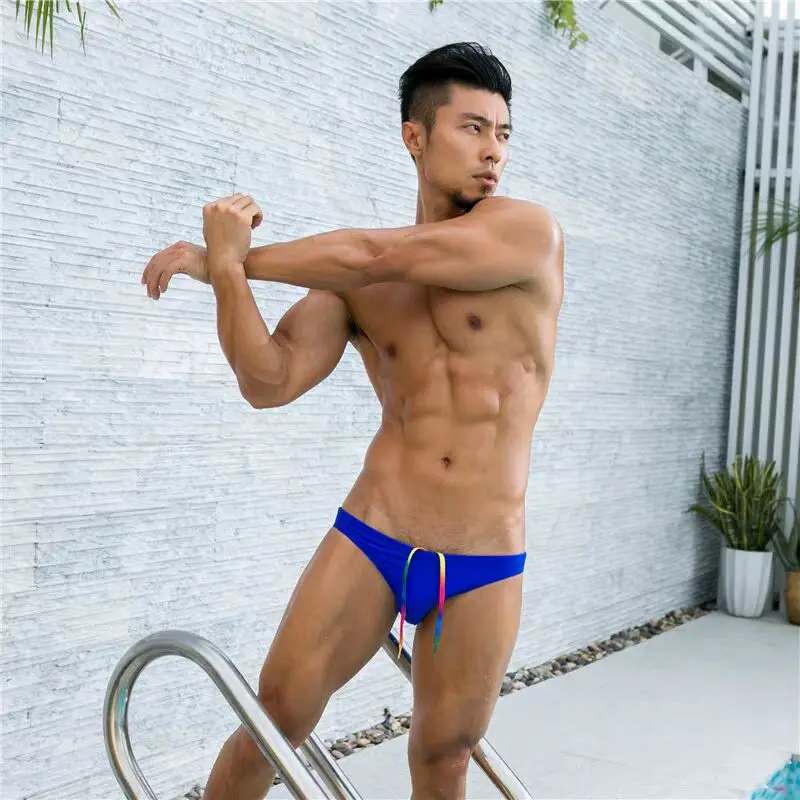 new Man triangle swimming trunks with low waist half wrapped buttocks narrow edge sexy rainbow swim shorts direct sales  2534