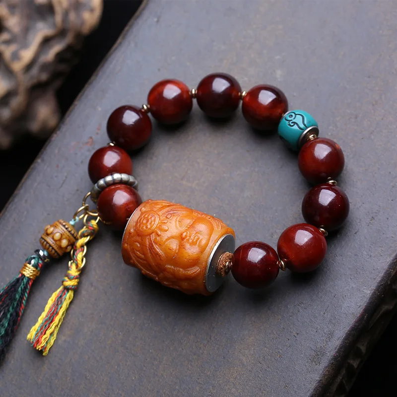 natural-golden-mountain-bone-bracelet-with-tassels-and-side-hanging-accessories-in-tibetan-style