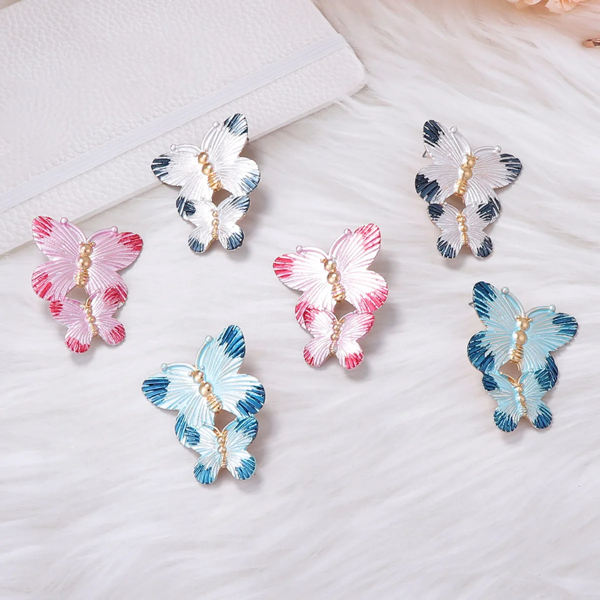 Simple French alloy spray paint smart double butterfly animal stud earrings exaggerated fashion versatile earrings