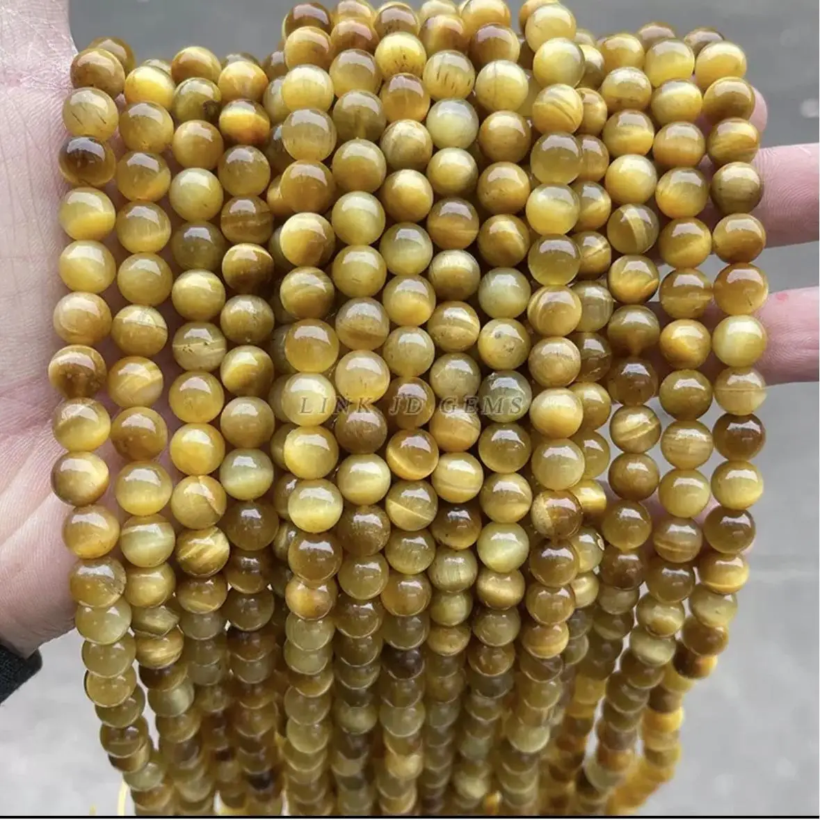 Natural golden tiger's eye loose beads, round beads, beaded bracelets, necklaces, and car ornaments for men and women.