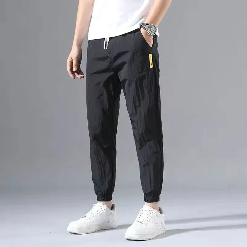 2024 Ice Shreds Men Summer Thin Style Trend Solid Color Loose Casual Motion Quick Drying Harun Bound Feet Large Size Trousers