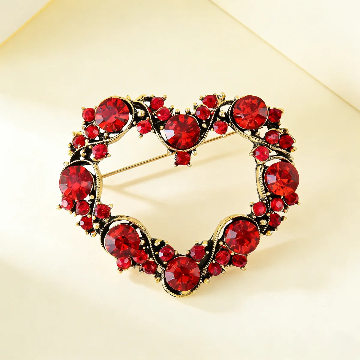 

Elegant openwork heart-shaped red diamond brooch, a versatile everyday accessory, or a vintage-inspired luxury party decoration.