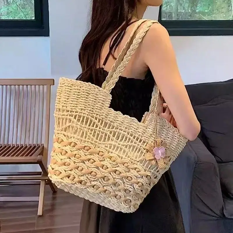 

Women's Large Handwoven Straw Tote Bag Bohemian Beach Shoulder Bag with Flower Charm for Summer Vacation
