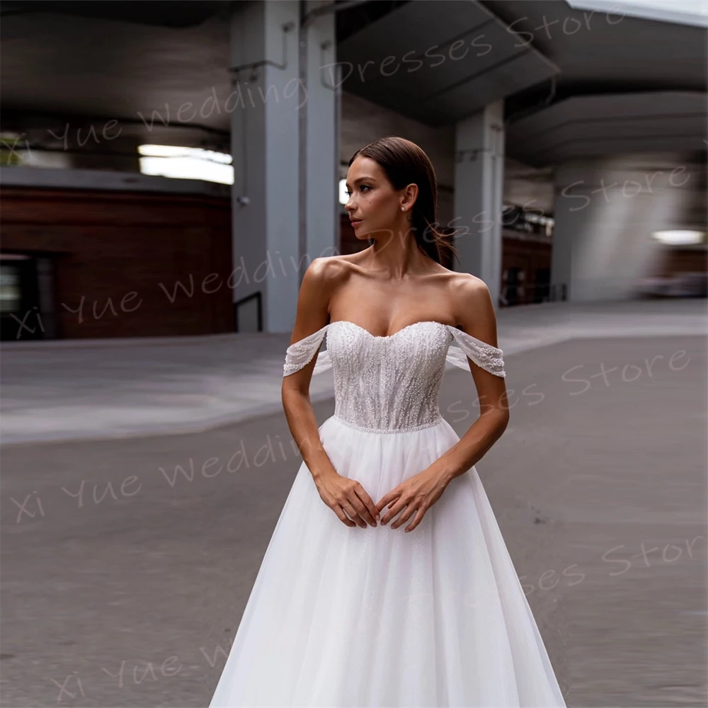 Elegancka linia damska suknie ślubne Off The Shoulder suknie panny młodej dostosowane Vestidos De Novia Boda seksowna bez rękawów Backless