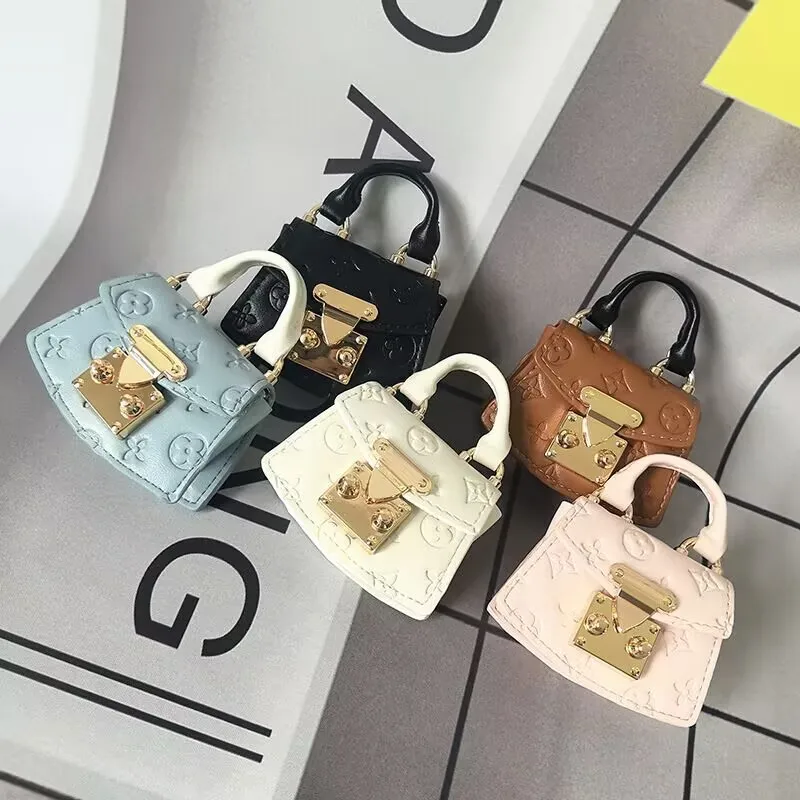 Bolsa decorativa pequeña, mini bolsa para monedas, bolsa para auriculares Xiaoxiangfeng, sobre rojo de moda, bolsa pequeña de almacenamiento, colgante para bolso.