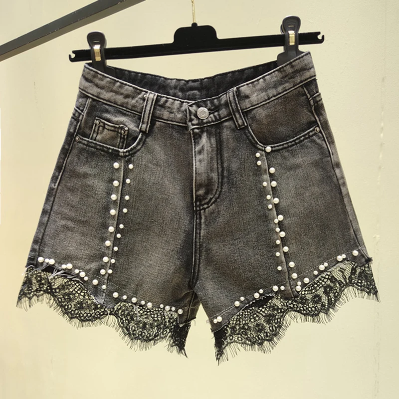 Pantaloncini di Jeans 2024 estate delle nuove donne a vita alta in pizzo perla Hotpants a-line Jeans Slim coreano Casual larghi pantaloncini a gamba larga