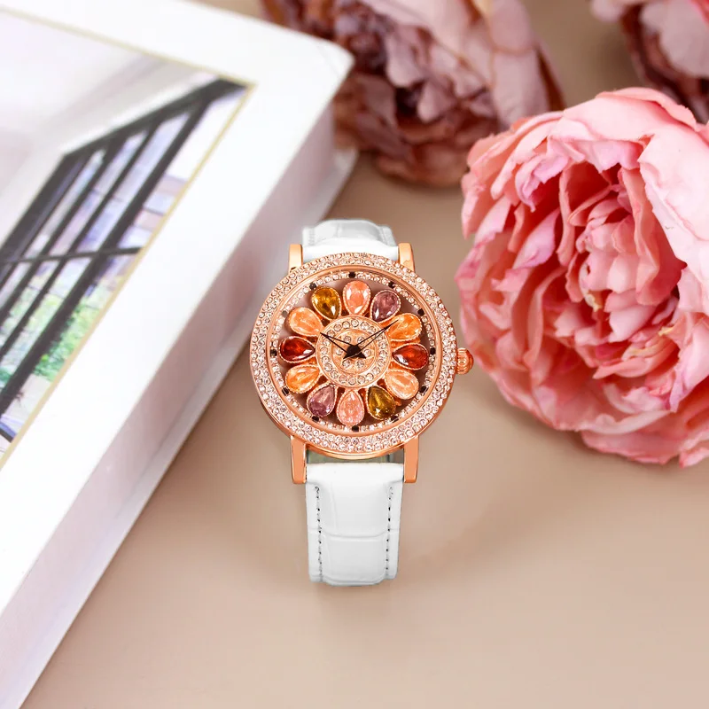 A women's white leather belt fashion stylish rainbow candy rotating dial quartz watch