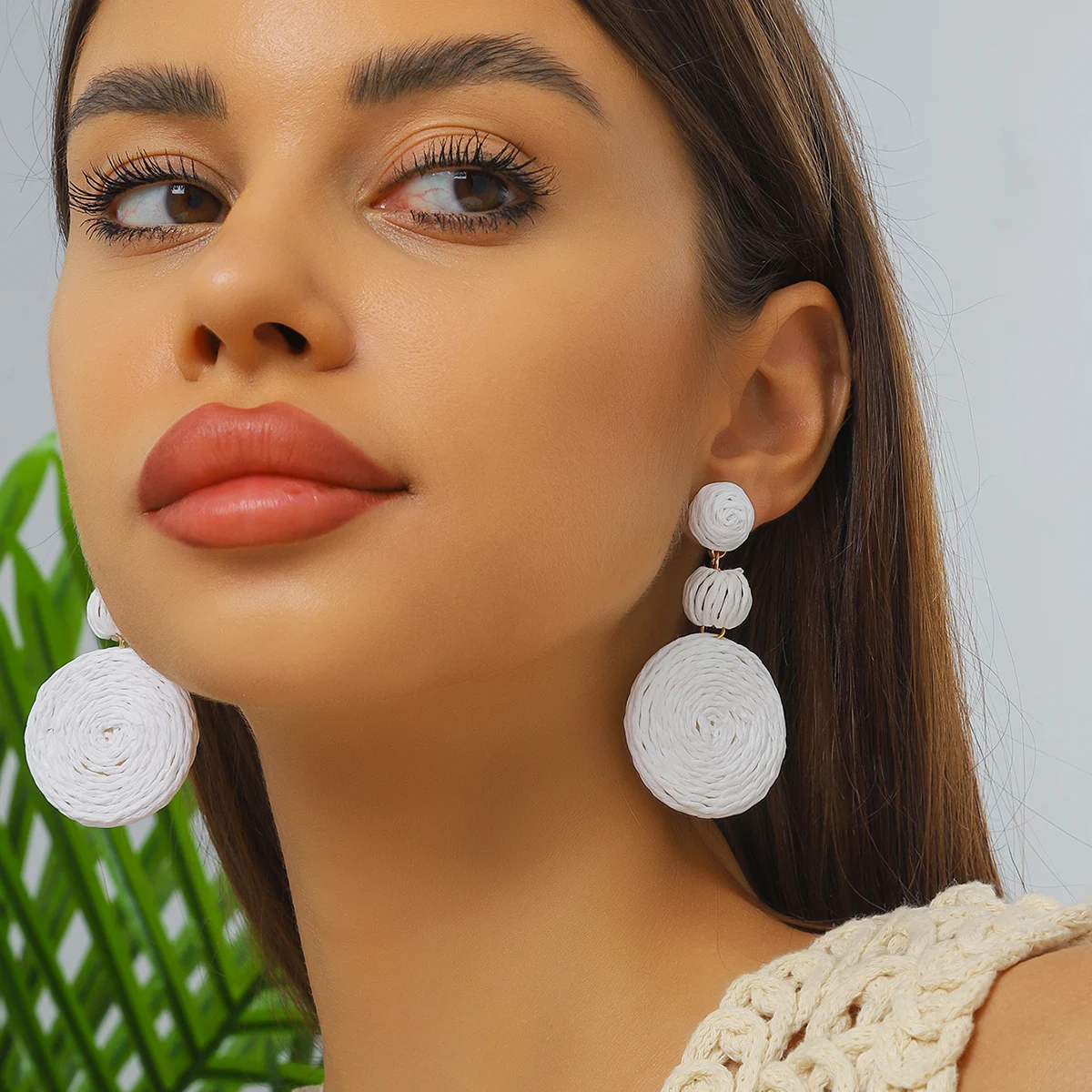 Bohemian-style handmade raffia earrings with Klein blue bead accents—perfect for women’s everyday wear and vacations