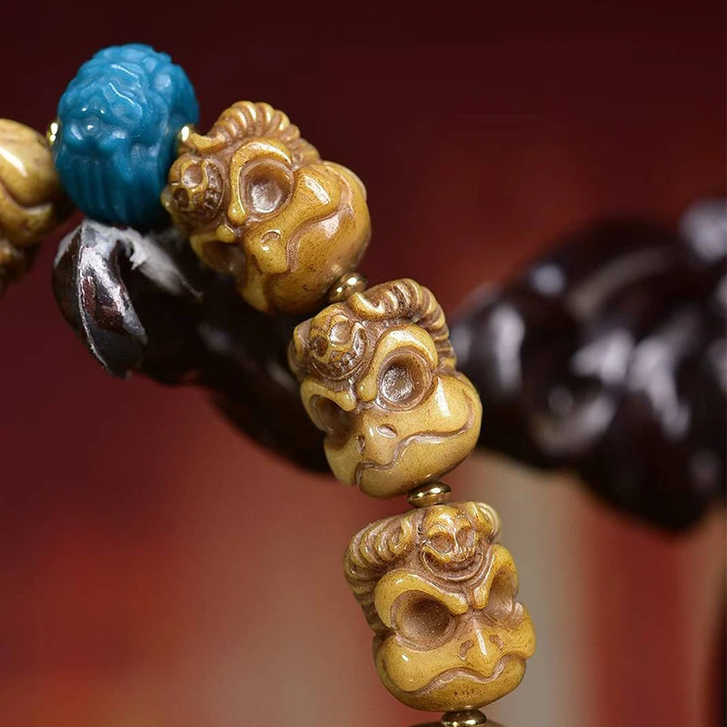 Hand-held Tibetan-style dice made from Yak bone with eighteen arhats and three-way connectors, used as an accessory a bracel