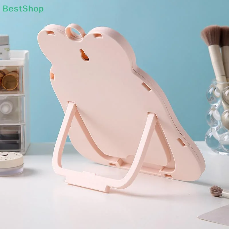 กระจกแต่งหน้าแบบตั้งโต๊ะ 1 ชิ้น ดีไซน์เรียบง่าย พกพาสะดวก กระจกแต่งหน้าแบบพับได้ สำหรับนักเรียน ขนาดกะทัดรัด น่ารัก พกใส่กระเป๋าได้