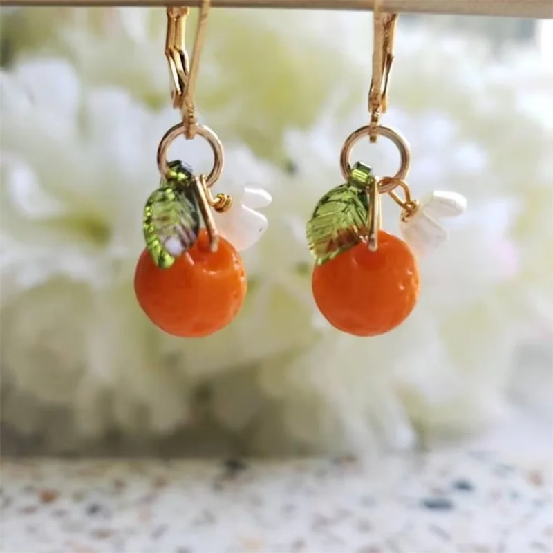 A Pair glass orange drop fruit earrings