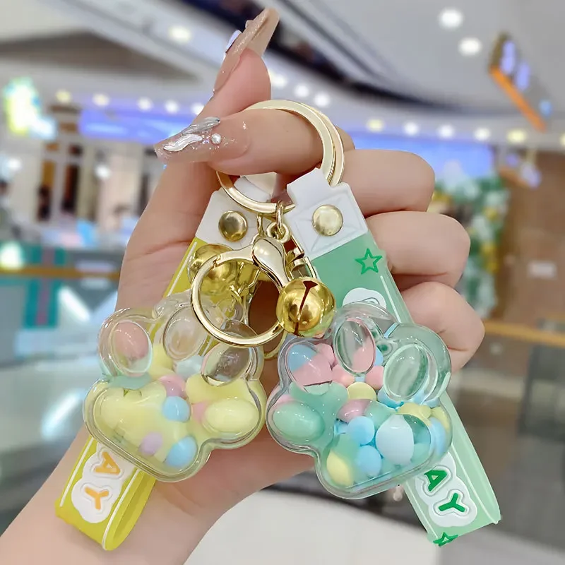 Cartoon Oil-Filled Cat Claw Bead Keychain, areia líquida flutuante, pingente de casais para decoração de bolsa de carro, fofo