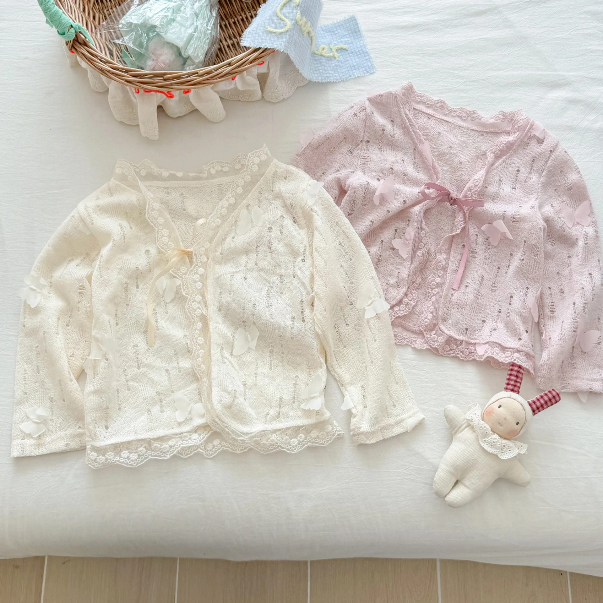 سترة صوفية محبوكة ناعمة بفيونكة جديدة للفتيات الصغيرات ملابس واقية من الشمس رقيقة للفتيات قمصان مفرغة لتكييف الهواء #1