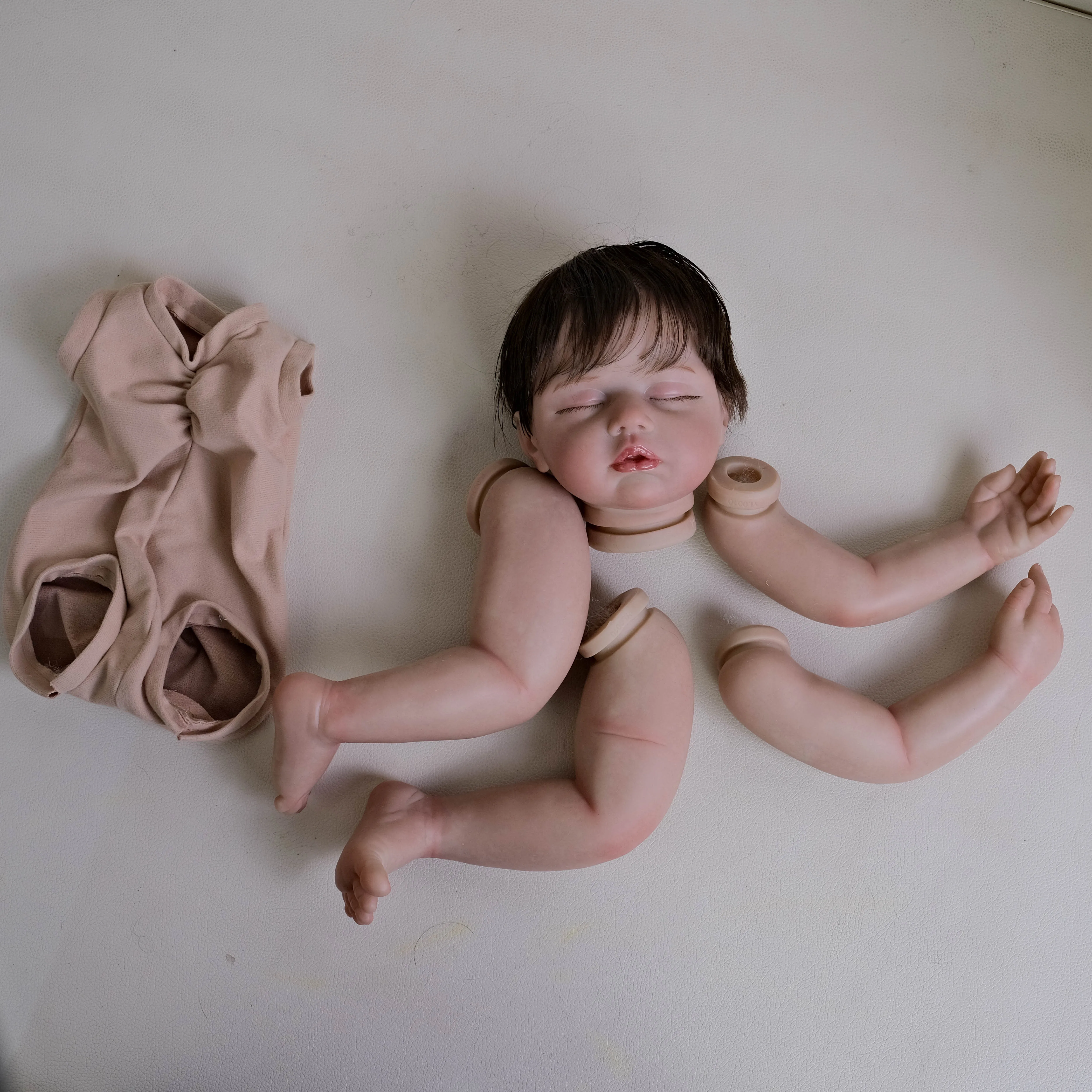 NPK 19inch Zoey Unfinished Painted Doll Kit Reborn Doll Parts with Hand Rooted Brown Hair Lifelike Doll for Collectors