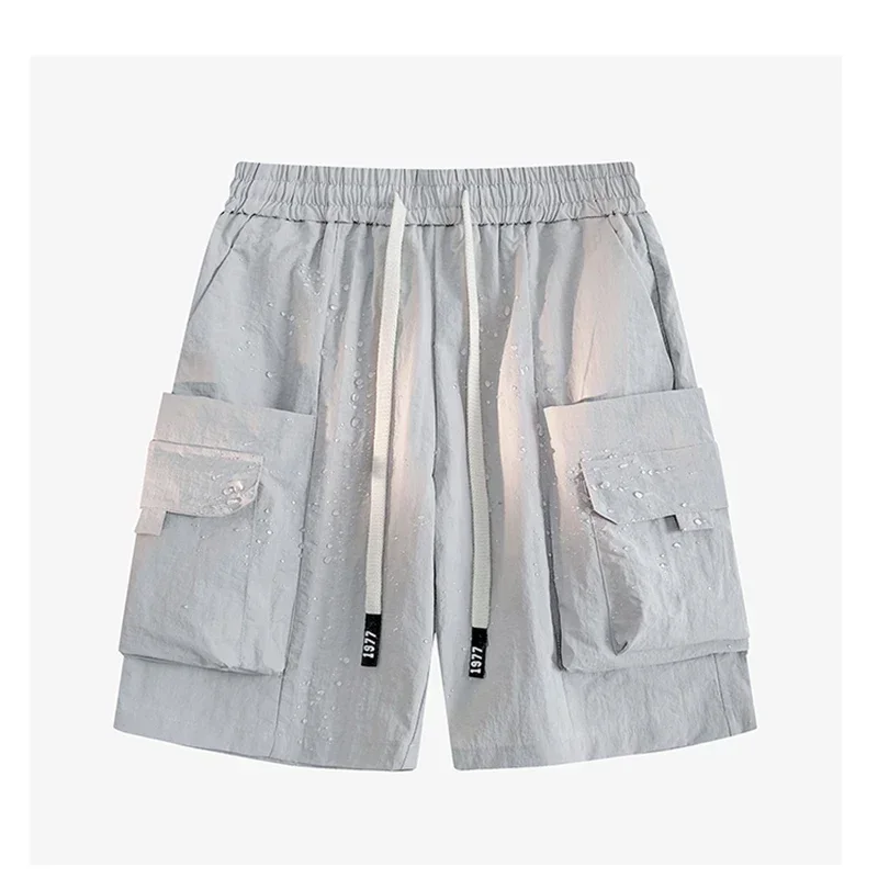 กางเกงขาสั้นผ้าไอซ์ซิลค์แห้งเร็วสำหรับผู้ชายสินค้าใหม่อเนกประสงค์สีพื้นทันสมัยและทันสมัยสำหรับฤดูร้อน