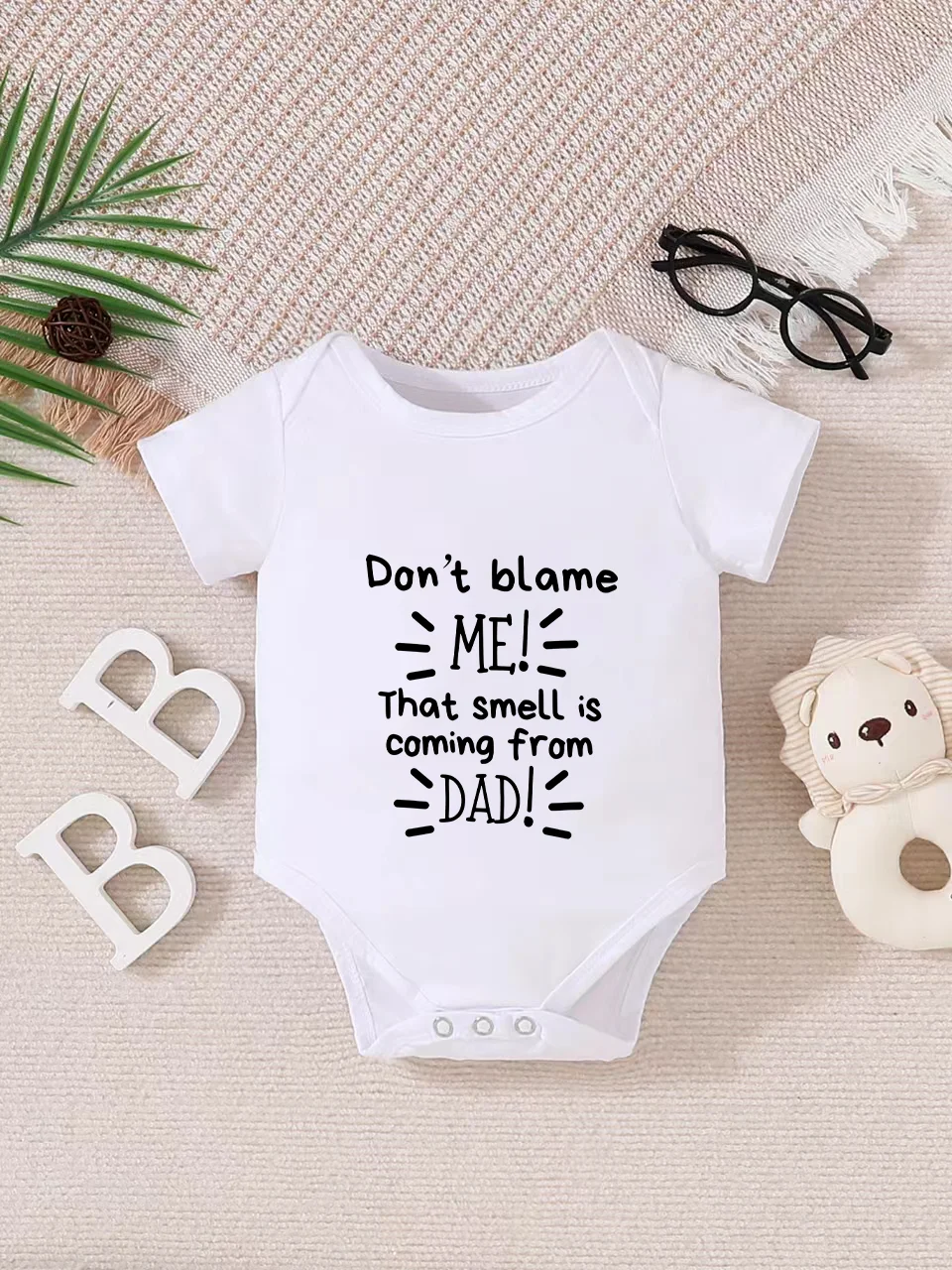 

Playful letter-printed baby short-sleeve triangle bodysuit. Button closure for easy dressing, machine washable