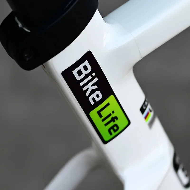 

Bicycle Life Reflective Waterproof Sticker - Durable PVC Green and White Text on Black Background,