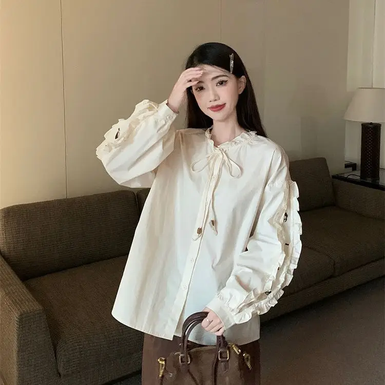 Spring and Autumn Heavy Industry Doll Head Embroidered Shirt Women\'s Temperament Bubble Sleeve Round Neck Shirt Fashion Top