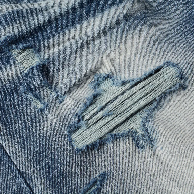 Hombre designer's fashionable new jeans, washed with nostalgia, stretchy, slim fit, perforated with cashew flower patch, light b