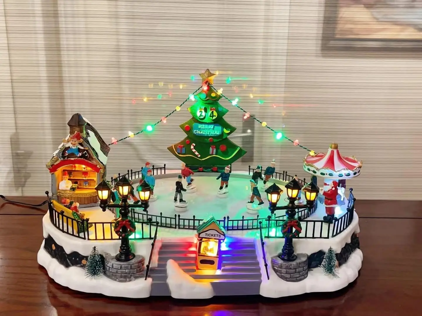 

Skating Christmas Village Animated Musical Winter Snow Village with 7 Moving Skaters Indoor Decorations for Home Tabletop Gift