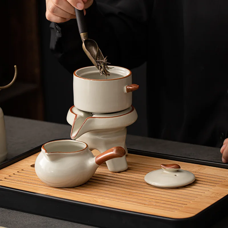 

HYS Kung Fu tea set, automatic tea brewer, lazy stone mill rotating water outlet, household Chinese teapot, teacup