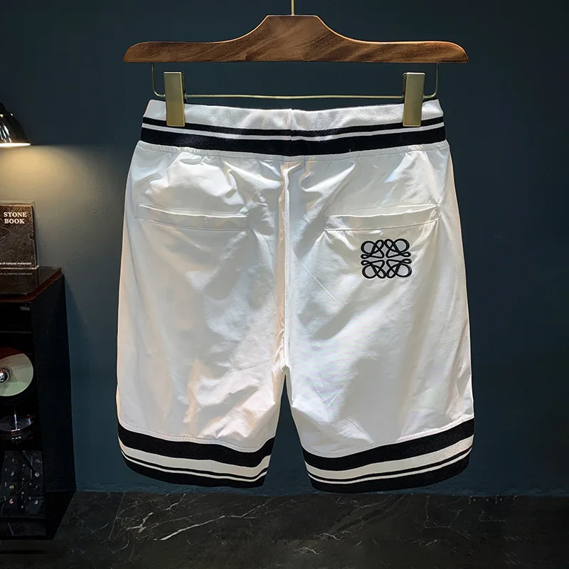 2025 summer new light luxury shorts men's straight leg loose and fashionable embroidered printed quick drying casual beach pants